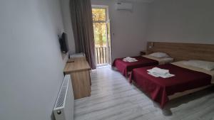 Voodi või voodid majutusasutuse Hotel Giorgi toas