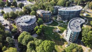 an aerial view of a building with trees at Park Apartments in Druskininkai