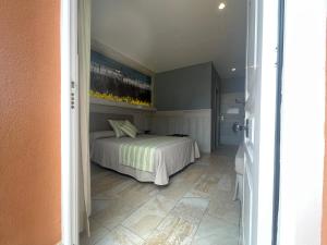 Postel nebo postele na pokoji v ubytování Hostal Noli