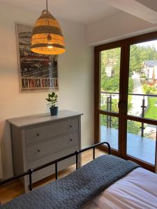 Łóżko lub łóżka w pokoju w obiekcie Apartament Chleb i Wino