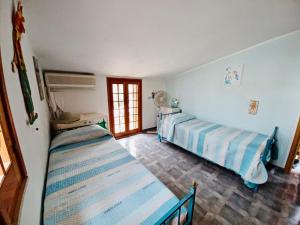 Postelja oz. postelje v sobi nastanitve Villetta mare di Sicilia