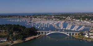 an aerial view of a marina with a bridge and boats at Le T-Top in La Trinité-sur-Mer +48 photos