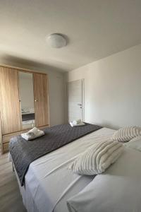 Ein Bett oder Betten in einem Zimmer der Unterkunft Villa Ante Škina