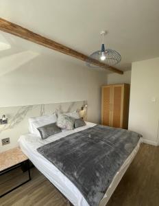 a bedroom with a large bed in a room at Whale Rock in Cape Town