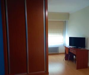 TV a/nebo společenská místnost v ubytování Pension San Roque