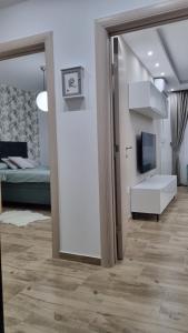 TV in/ali zabaviščno središče v nastanitvi Apartman Ivkovic