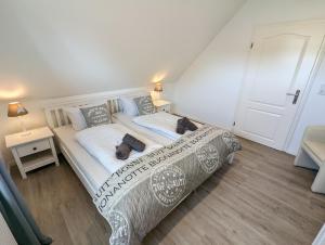 Postel nebo postele na pokoji v ubytování Das Inselhaus
