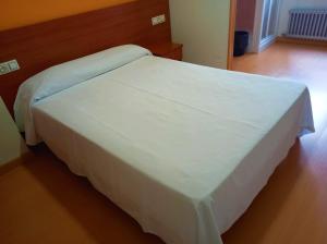 Postel nebo postele na pokoji v ubytování Pension San Roque