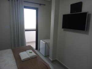 TV a/nebo společenská místnost v ubytování Hotel Solar Vitória