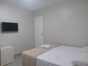 Postel nebo postele na pokoji v ubytování Hotel Solar Vitória