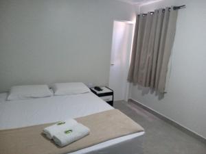 Postel nebo postele na pokoji v ubytování Hotel Solar Vitória