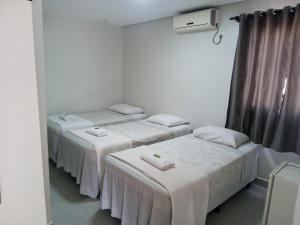 Postel nebo postele na pokoji v ubytování Hotel Solar Vitória