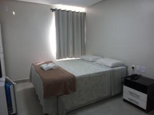 Postel nebo postele na pokoji v ubytování Hotel Solar Vitória