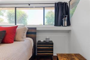 a bedroom with a bed and a window at Nightlife & Shop Old Town Scottsdale - Studio Unit in Scottsdale