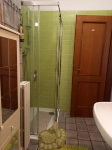 a bathroom with a shower with a glass door at Gioiamare in Martinsicuro