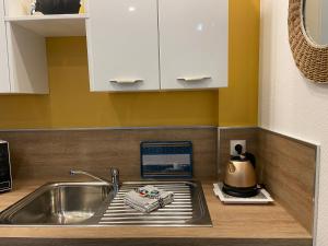 Nhà bếp/bếp nhỏ tại "Appartement sur digue" proche de la plage avec wifi +64 ảnh