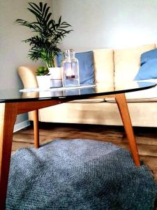 a coffee table in a living room with a couch at Rostock hautnah erleben - schöne Maisonette 2OG in Rostock