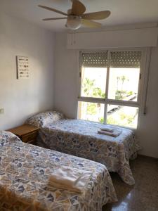 Postel nebo postele na pokoji v ubytování Precioso apartamento en Urbanización junto al mar. + 20 fotografií