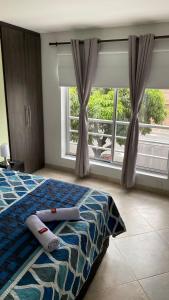 Ένα ή περισσότερα κρεβάτια σε δωμάτιο στο Amoblado laureles San Joaquín