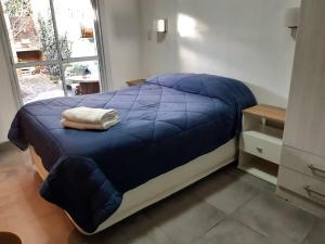 A bed or beds in a room at Estación Libertad
