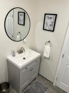 a bathroom with a sink and a mirror at Tiny Home in El Paso