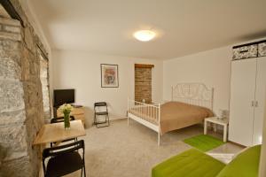 Posteľ alebo postele v izbe v ubytovaní Guesthouse Totićevi