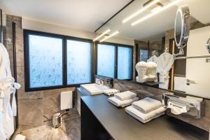 a bathroom with a sink and a mirror at MOYÏ in Basse-Goulaine +30 photos