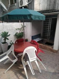 En terrasse eller udendørsområde på Casa Temporada - 2 Quartos