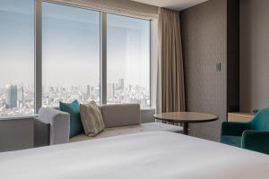 מיטה או מיטות בחדר ב-The Strings by InterContinental, Tokyo by IHG