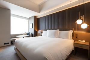 מיטה או מיטות בחדר ב-The Strings by InterContinental, Tokyo by IHG