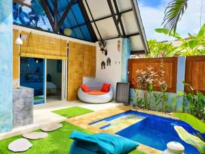 a patio with a swimming pool and a bed in a house at Salt villas Gili Air in Gili Air
