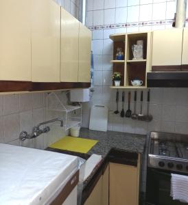 a kitchen with a sink and a counter top at SUMAQ WASICHA SALTA in Salta