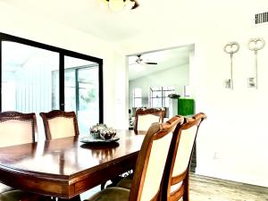 a dining room with a wooden table and chairs at Luxurious Bungalow in Payson in Payson