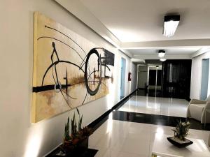 a living room with a painting on the wall at Apartment in the touristic heart of Mexico City in Mexico City