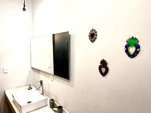 a bathroom with a sink and a mirror at Apartment in the touristic heart of Mexico City in Mexico City