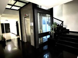 a hallway of a building with a staircase and a door at Apartment in the touristic heart of Mexico City in Mexico City