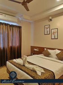 Postel nebo postele na pokoji v ubytování Hotel ESSENCE