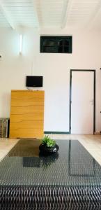 a room with a black rug and a wooden door at Appartement de 2 chambres avec jardin clos et wifi a Basse Terre in Basse-Terre