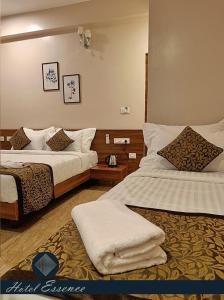 Postel nebo postele na pokoji v ubytování Hotel ESSENCE