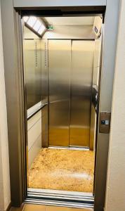 an empty refrigerator with its door open in a room at Bella Vista in Poris de Abona