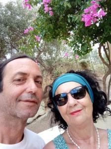 a man and a woman posing for a picture at Malia sea view in Pírgos