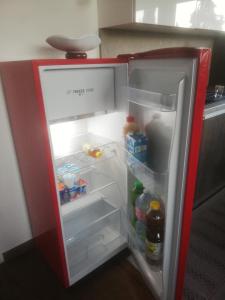 an empty refrigerator with its door open in a kitchen at Il sospiro in Satriano di Lucania