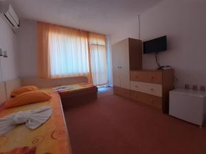Postel nebo postele na pokoji v ubytování Guest House Malkata Stopanka + 37 fotografií