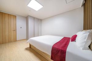 Postel nebo postele na pokoji v ubytování EdenStay