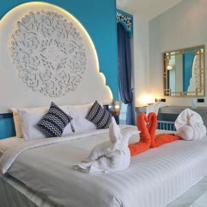 Кровать или кровати в номере The Kiri Villas Resort