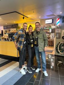 a group of three people posing for a picture in a store at Comfort Hotel Malmö in Malmö