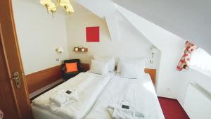Posteľ alebo postele v izbe v ubytovaní Hotel Hradec