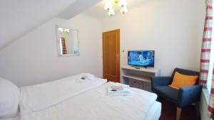 Posteľ alebo postele v izbe v ubytovaní Hotel Hradec