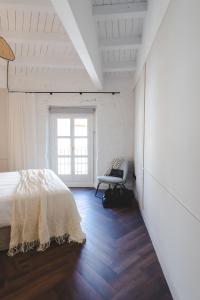 Posteľ alebo postele v izbe v ubytovaní ORA Hotel Priorat, a Member of Design Hotels