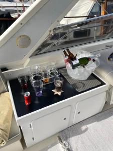 a table with drinks and glasses on a boat at Boat in Puerto de Mogán in Puerto de Mogán